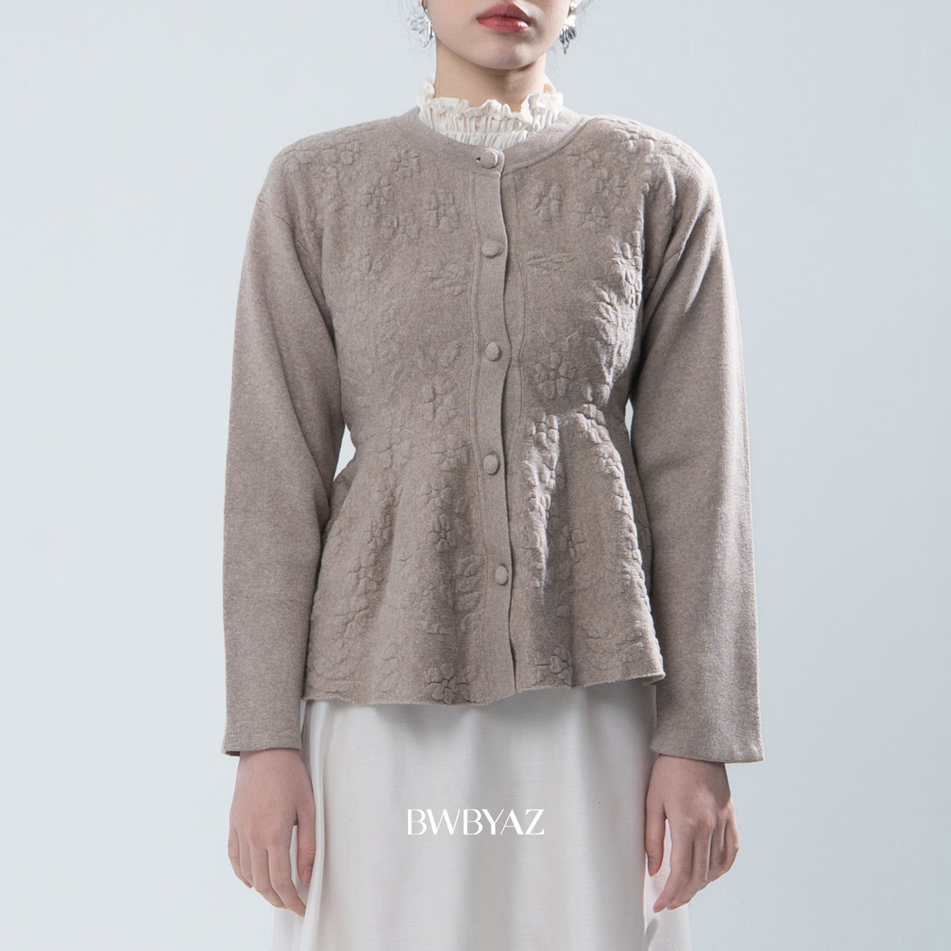 Light brown textured knit cardigan worn by a person on a light gray background, with 'BWBYAZ' branding.