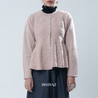 Light pink textured knit cardigan worn by a person on a light gray background, with 'BWBYAZ' branding.
