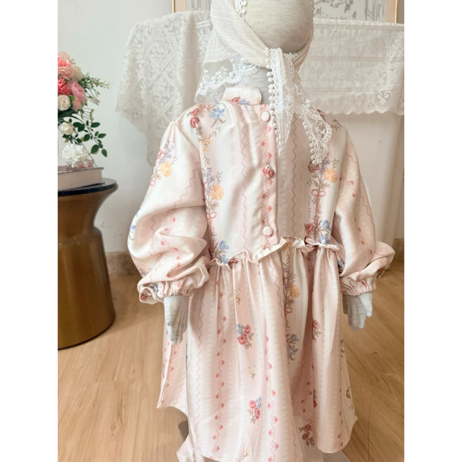 Floral outfit set by Haidee Orlin with pink accents on a mannequin with lace details in a room setting