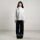 Person wearing a white and blue striped shirt by BWBYAZ and black pants on a plain background.