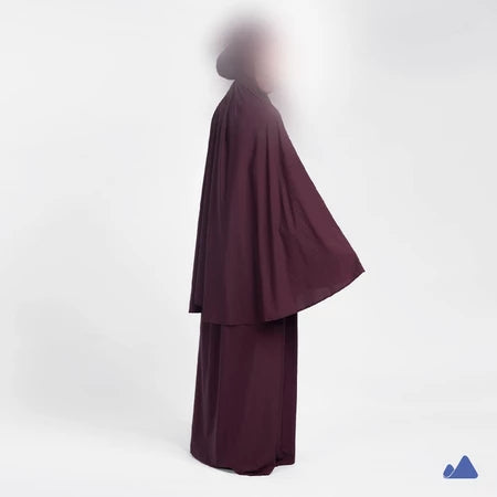 Burgundy prayer hijab with a draped design from Muhajir Project on a white background