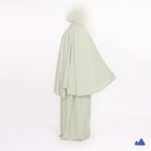 Light green prayer hijab with a draped design from Muhajir Project on a white background