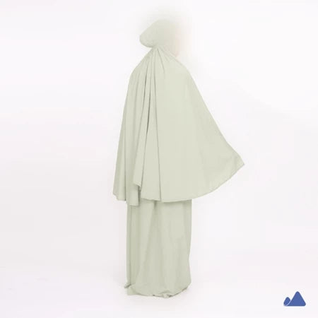 Light green prayer hijab with a draped design from Muhajir Project on a white background