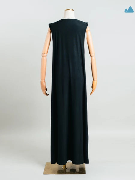 Rear view of black sleeveless dress from Muhajir Projecton a mannequin against a white background