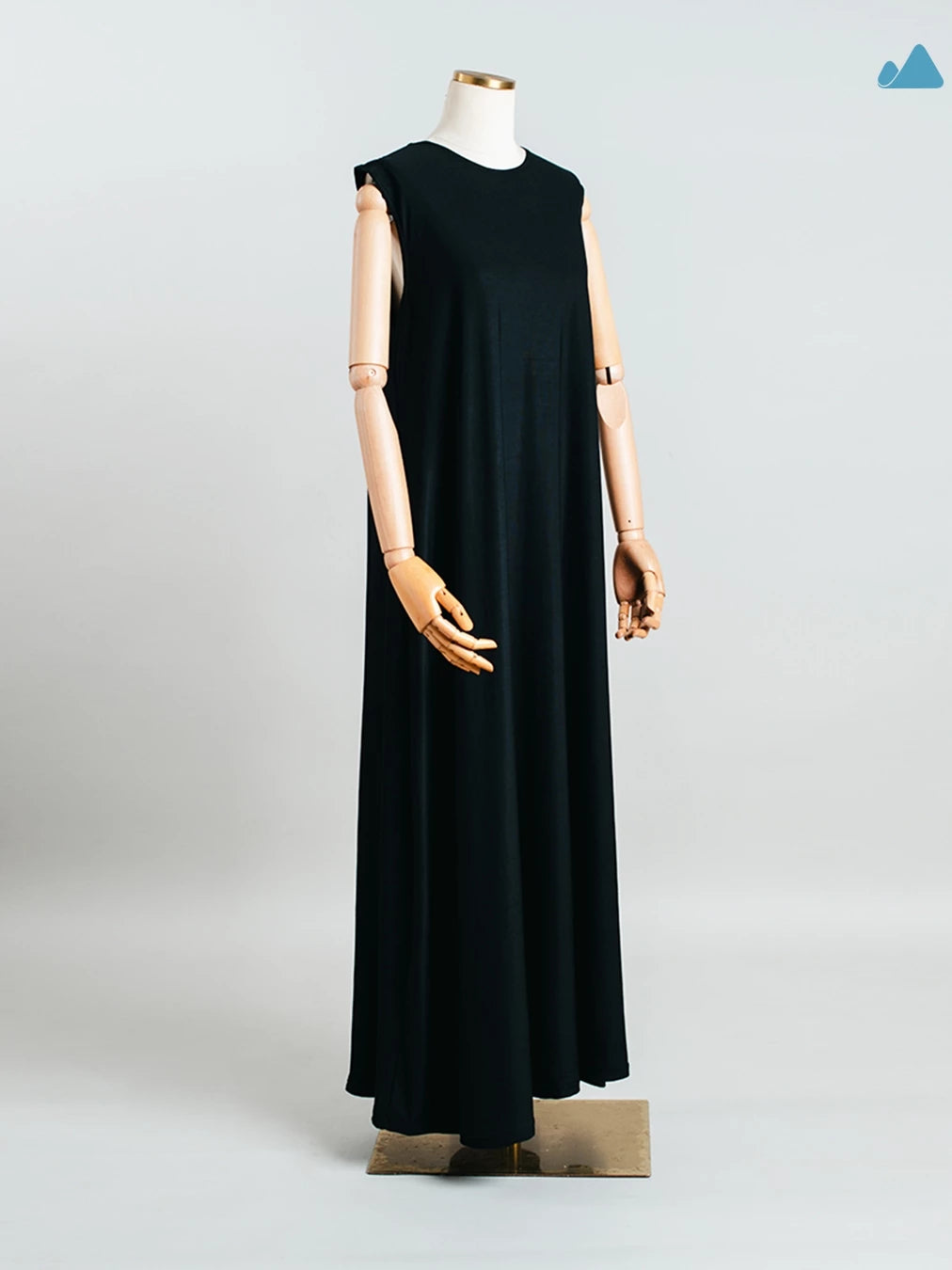 Black sleeveless dress from Muhajir Project on a mannequin against a light gray background