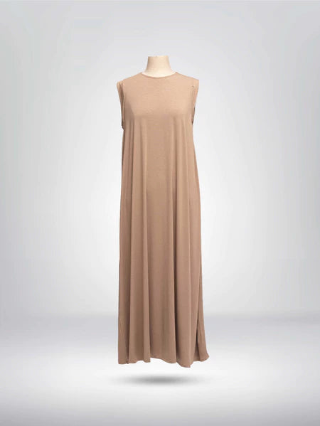 Front view of light brown sleeveless dress from Muhajir Project on a mannequin against a gray background