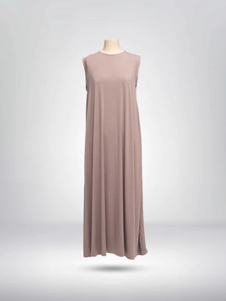 Front view of light pink sleeveless dress from Muhajir Project on a mannequin against a gray background