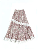 Long asymmetric skirt by Kartinis Label with mermaid silhouette cut, lace details, and side opening with zipper.