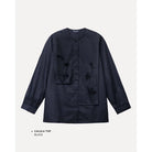 Black shirt by Maima with floral details on a light gray background