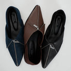 Three pointed-toe slip-on flats shoes with front zipper details, shown in navy blue, brown, and black. The shoes are arranged side-by-side on a light gray background, with the brand name 'Cekhas' visible on the insoles.