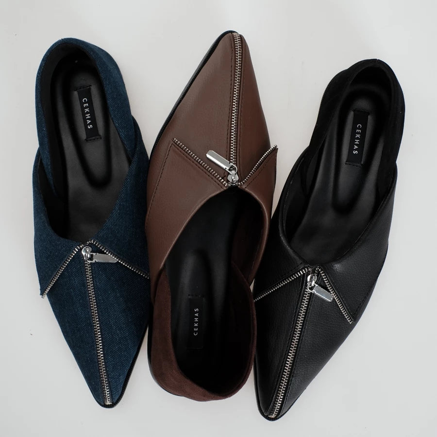 Three pointed-toe slip-on flats shoes with front zipper details, shown in navy blue, brown, and black. The shoes are arranged side-by-side on a light gray background, with the brand name 'Cekhas' visible on the insoles.