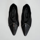 A pair of black leather pointed-toe flats shoes with a silver zipper detail running up the center front, shown from a top-down view on a light gray background. The brand name 'Cekhas' is visible on the insole.