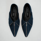 A pair of dark blue denim pointed-toe flat shoes with a silver zipper detail across the front, shown from a top-down view on a light gray background. The brand name 'Cekhas' is visible on the insole.