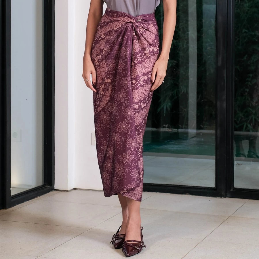 Person wearing a wine-colored patterned skirt by Holypeony standing indoors.