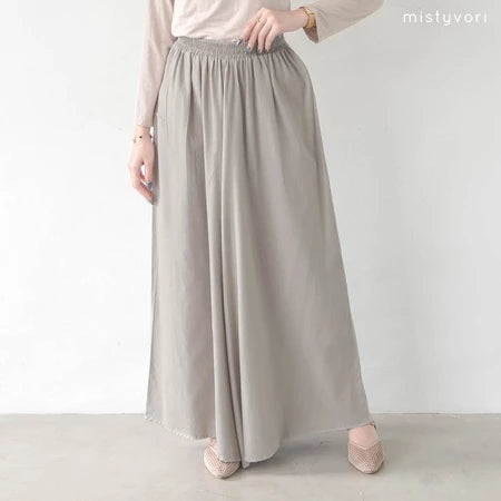 Person wearing a long light gray pants by Mistyvori on a plain background