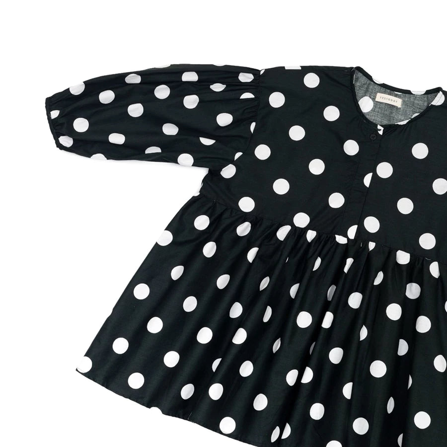 Black dress with white polka dots by Yestoday on a white background