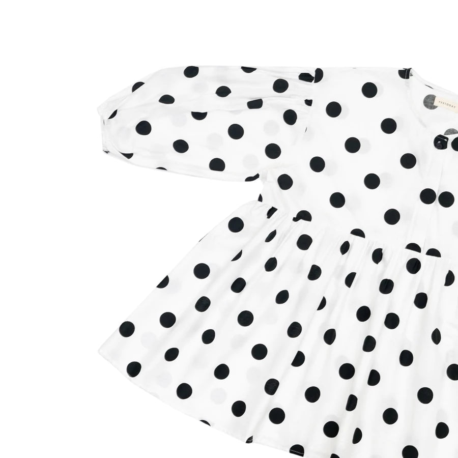 White dress with black polka dots by Yestoday on a white background