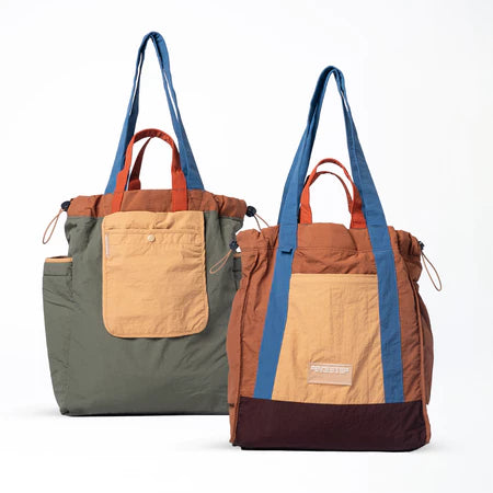 Reversible tote bag with different color combinations from Muhajir Project on a white background