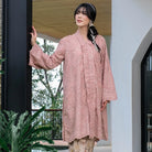 Woman wearing a pink women’s tunic by Holy Peony with subtle floral patterns, a loose silhouette, and wide sleeves. The tunic features a layered front detail and above-the-knee length, creating an elegant and flowy look.

Wanita mengenakan tunik wanita warna merah muda dari Holy Peony dengan motif floral halus, potongan longgar, dan lengan lebar. Tunik memiliki detail layering di bagian depan dengan panjang di atas lutut, menciptakan tampilan elegan dan flowy.