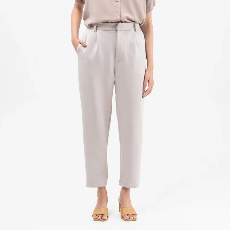 Light grey ankle pants from Atala Scarves worn by a person on a white background