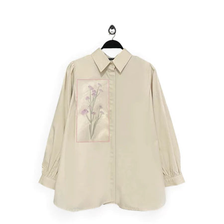 Beige shirt with floral design named Gwen Top from Maima on a white background