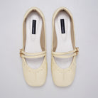Butter Yellow Mary Jane flatshoes by Cekhas with double buckle straps and square toe design.