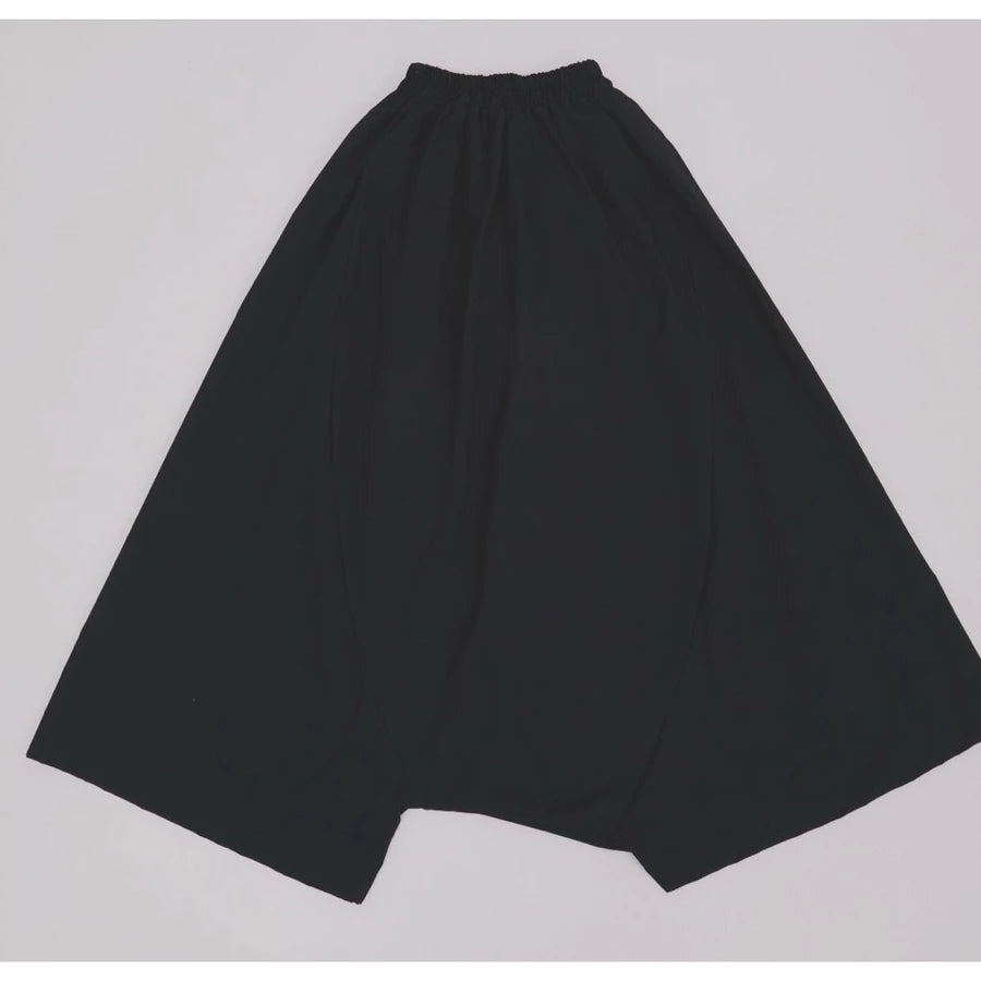 Black pants by Yestoday on a light gray background