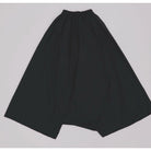 Black pants by Yestoday on a light gray background