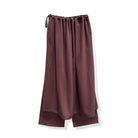 Brown satin pants with drawstring waist by Rashawl on a white background