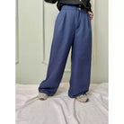 A navy high-waisted cullote trousers by Abame with a wide leg, displayed on a model against a plain background.
