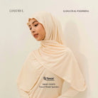Woman wearing a cream Lishawl Ilana Oval Pashmina by BWBYAZ on a light background