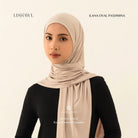 Woman wearing a beige Lishawl Ilana Oval Pashmina by BWBYAZ on a plain background