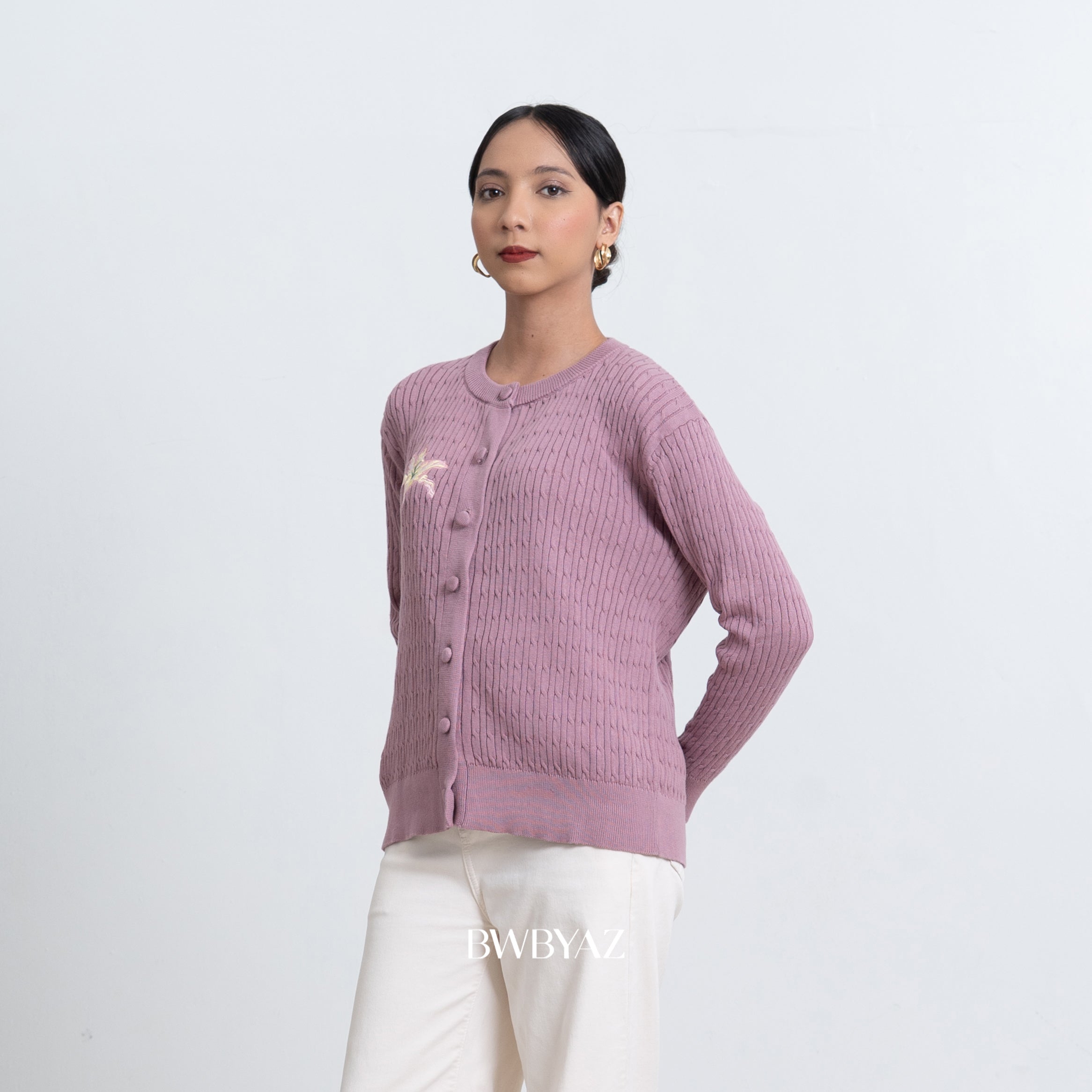 Woman wearing a purple knitted cardigan by BWBYAZ on a white background