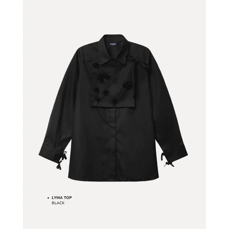 Black top by Maima with bow details on a light gray background