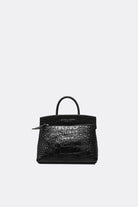 Black crocodile skin ace handbag by Aesthetic Pleasure on a white background