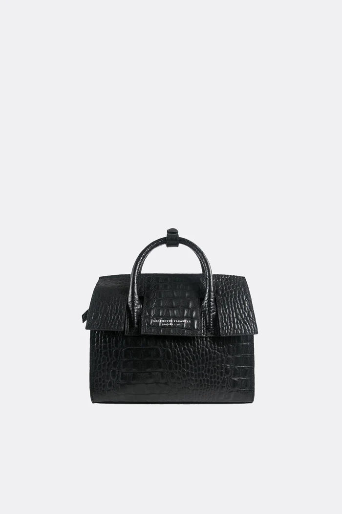 Black croc leather textured mini handbag by Aesthetic Pleasure on a light gray background