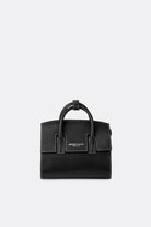 A mini-sized black grain leather handbag with a detachable strap and silver-tone hardware, featuring a front logo stamp and a tubular handle by Aesthetic Pleasure.