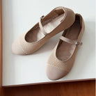 Pair of beige mesh ballerina flatshoes  by Tutu Toe on a white surface