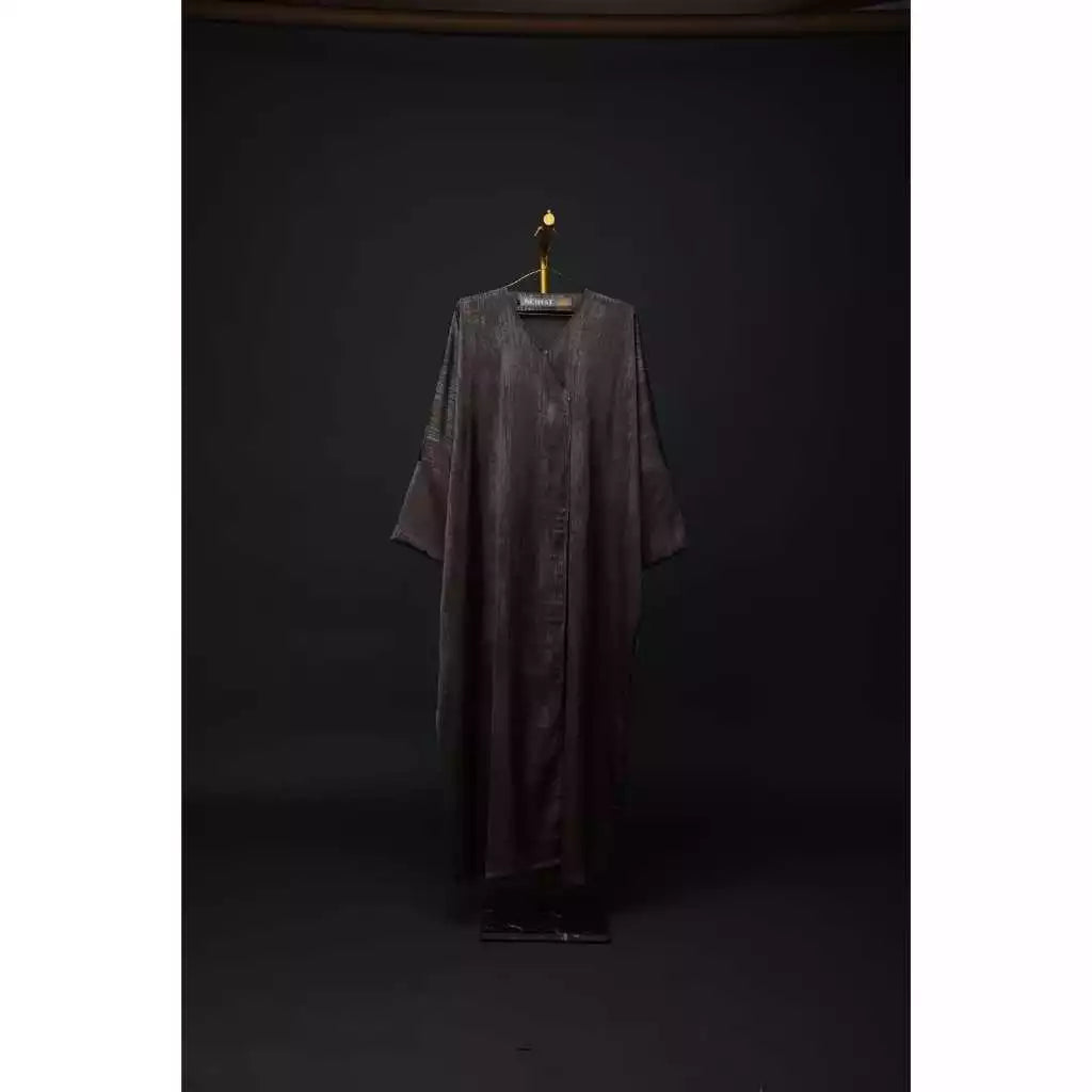 Long dark outer robe by Nehhat Modest on a hanger against a black background
