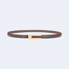 Khaki leather belt with a rose gold buckle from Atala Scarves on a light gray background