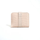 A closed brown bifold wallet from purotti with a textured surface, displayed against a solid background.