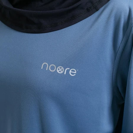 Blue activewear tops with 'noore' logo on a close-up of fabric texture
