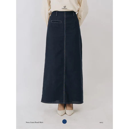 Navy denim pencil skirt by Swifter worn by a person on a light gray background
