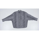 Black and white checkered oversized shirt by Yestoday on a white background