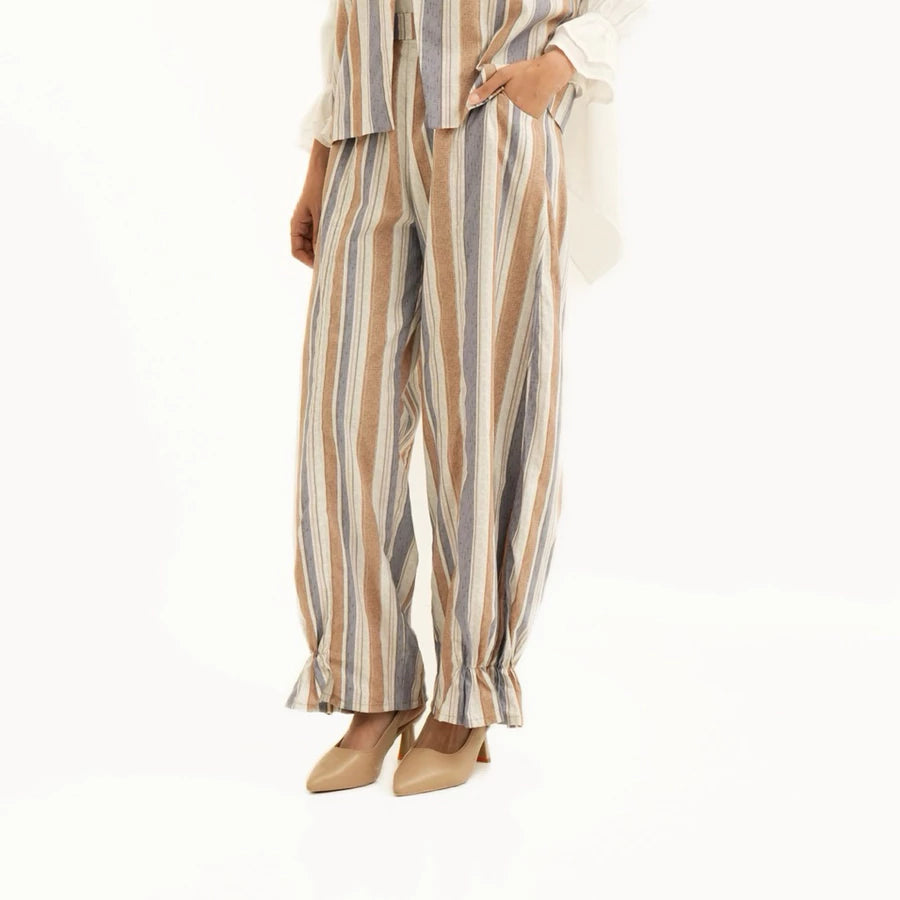 Striped pants by Tunique worn by a person on a white background