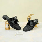 Black lace shoes with bows by Dianable on a decorative background
