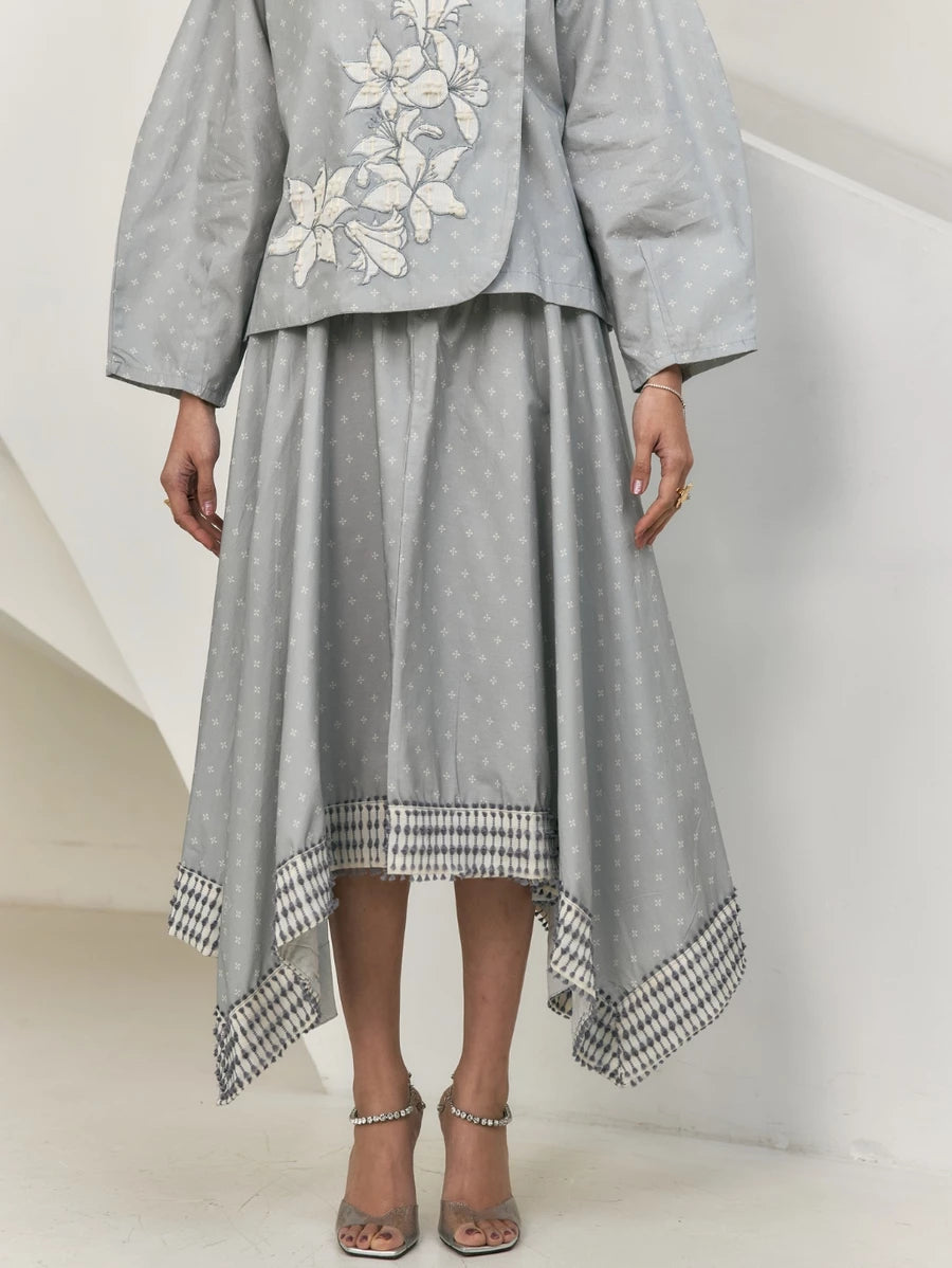 Gray top with floral embroidery and matching gray skirt by Studio Tui on a white background