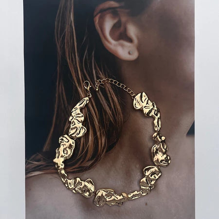 Gold necklace by Darje with unique design