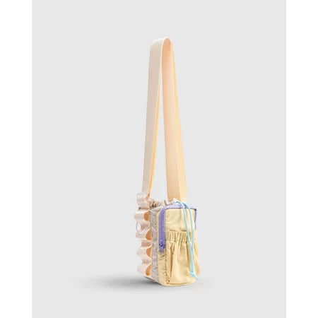 Small handbag with a strap from Muhajir Project on a light gray background