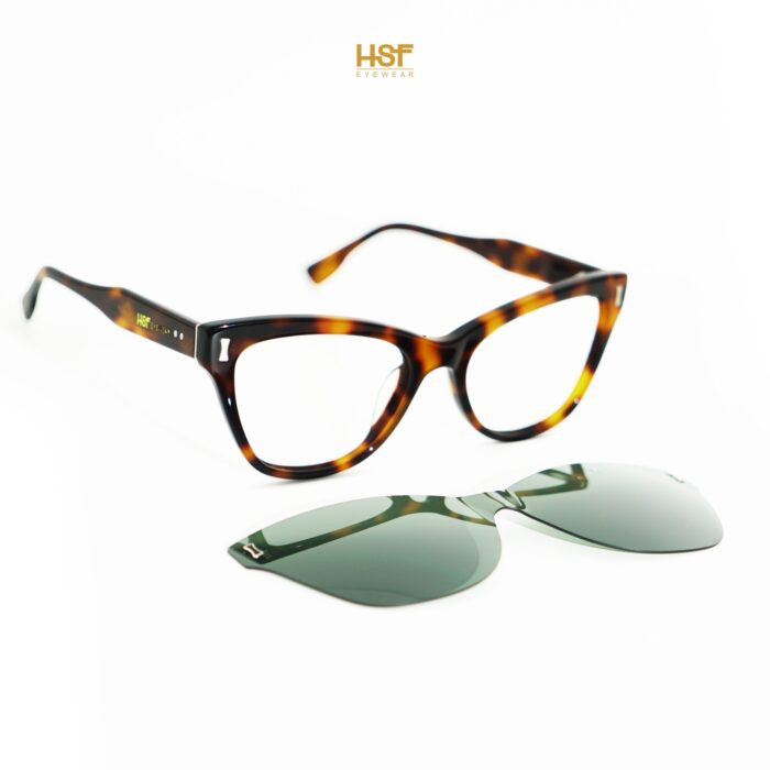 Tortoiseshell eyeglasses with a clip-on green lens by HSF Eyewear on a white background